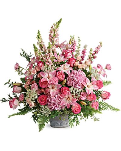 <p>Filled with soft pink blooms and flowing greenery, this arrangement brings a peaceful, feminine presence to the service and offers a tender expression of sympathy to family and friends. This deluxe display features light pink hydrangea, classic pink roses, and light pink spray roses as its foundation.</p>