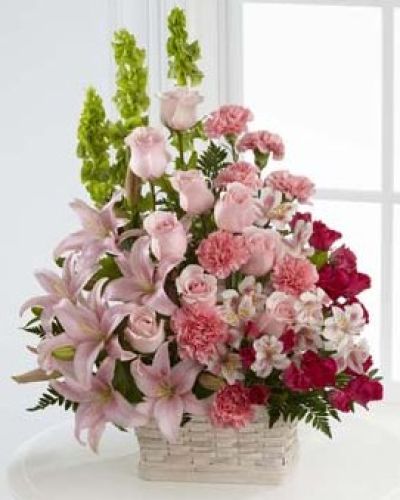 <p>Filled with soft pink blooms and fresh greenery, it offers a comforting expression of sympathy that reflects the gentle spirit of a loved one who has passed. At the heart of the design are blushing pink roses, fragrant Asiatic lilies, and graceful Peruvian lilies, chosen for their symbolic meanings of admiration, love, and remembrance.</p>