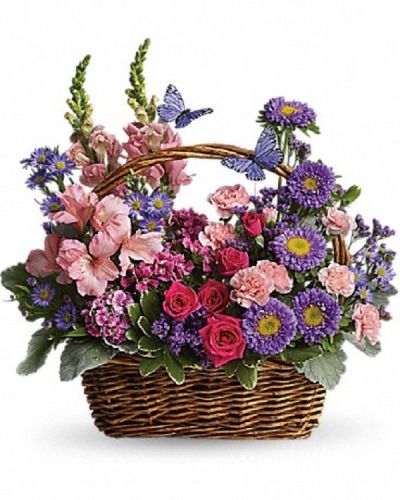 <p>This wicker basket overflows with fresh flowers, including hot pink spray roses, light pink alstroemeria, snapdragons, miniature carnations, dark pink Sweet William, purple Matsumoto asters, large Monte Casino asters, statice, and pittosporum.</p>