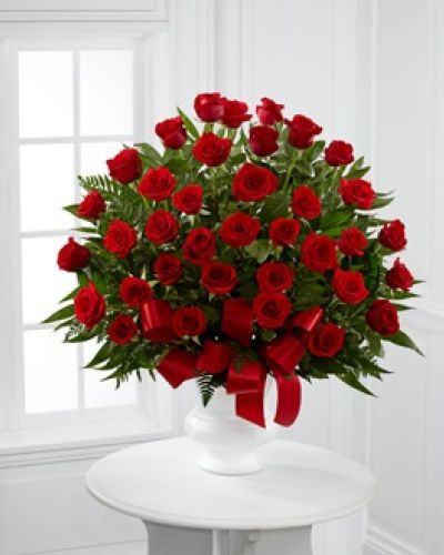 <p>This arrangement features radiant red roses, each carefully chosen to represent enduring affection, deep admiration, and bonds that continue beyond parting. Set against lush premium greenery, the rich red roses rise with grace and confidence, offering a dignified and emotional farewell.</p>