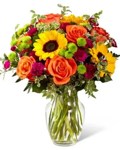 <p>The Color Craze Bouquet blooms with a vibrant energy to create a special moment for your recipient! Our floral professionals weave together a blend of orange roses, sunflowers, violet mini carnations, green button poms, and lush greens to create an incredible gift. Presented in a clear glass vase, this truly colorful display of fresh flowers is ready to send your warmest birthday, thank you, or get well wishes straight to their door.</p>