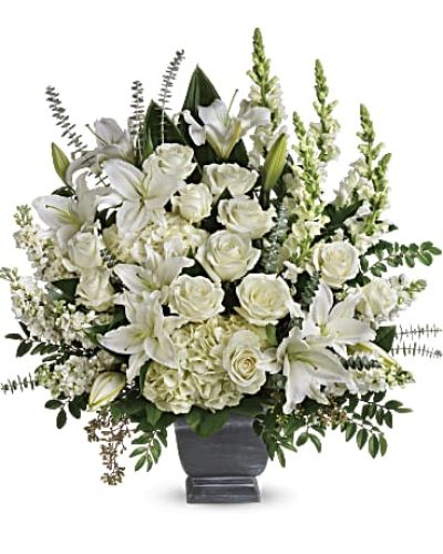 <p>This bouquet features a stunning combination of white hydrangea, white roses, oriental lilies, snapdragons, and stock. Accented with lush greenery including huckleberry, seeded eucalyptus, spiral eucalyptus, green ti leaves, and lemon leaf, the arrangement creates a rich and balanced display that conveys harmony and grace.</p>