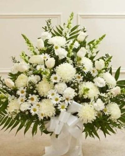 <p>This Touching Tribute Floor Basket in white is a graceful and elegant arrangement thoughtfully designed to bring comfort and honor the memory of a loved one with dignity and care.</p>