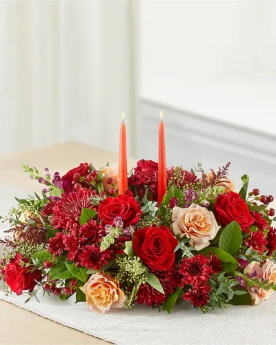 <p>Varying shades of red, burgundy and soft, peach combine in this captivating fall centerpiece to effortlessly complete your own tablescape, or send it ahead to your host.</p>