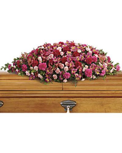 <p>Honor a beautiful soul with a graceful floral spray that captures the tenderness, affection, and deep respect felt for someone dearly missed. This elegant tribute features a rich blend of pink favorites, including dark pink alstroemeria, hot pink carnations, classic pink carnations, and miniature light pink carnations.</p>