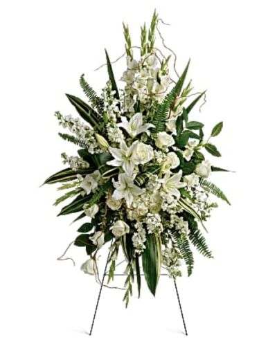 <p>This beautiful standing spray honors a cherished life with quiet elegance and thoughtful care. The arrangement features a harmonious blend of white hydrangea, white roses, oriental lilies, gladioli, and stock.</p>