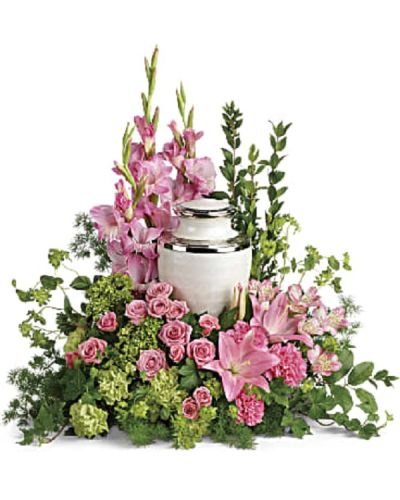 <p>The elegant design features a delicate mix of pink blooms, including miniature green hydrangea, pink spray roses, Asiatic lilies, alstroemeria, gladioli, and carnations. Accented with green carnations, bupleurum, ivy, myrtle, ming fern, and lemon leaf, the bouquet is rich in texture and color, creating a soft, graceful presence.</p>