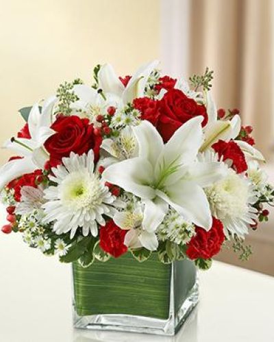 <p>Bold red roses take center stage, symbolizing enduring love and strength. Accented by fresh greenery and arranged in a timeless clear glass vase, the bouquet achieves a perfect balance—both visually and emotionally—between power and peace.</p>