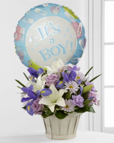<p>This bouquet includes a balanced blend of lavender roses, soft lavender daisies, ruffled carnations, white Asiatic lilies, and bold blue iris. Lush greenery adds texture and fullness, while the flowers are presented in a whitewash woodchip basket that brings a rustic, natural touch to the arrangement.</p>