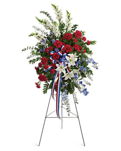 <p>Designed in the symbolic colors of red, white, and blue, this spray offers a powerful statement of gratitude and remembrance for members of the military, veterans, and patriotic loved ones who served with honor.</p>