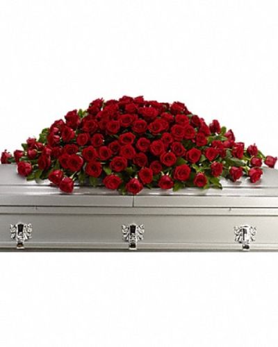 <p>This rich and regal casket spray is designed to honor a cherished life with timeless elegance. The full spray features an abundant display of crimson red roses, expertly arranged with alternating large and slightly smaller stems to create depth and texture.</p>