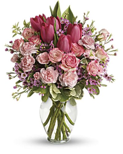 <p>Bursting with tantalizing tulips and radiant roses, this delightful pink arrangement brings spring joy to that special someone.</p>