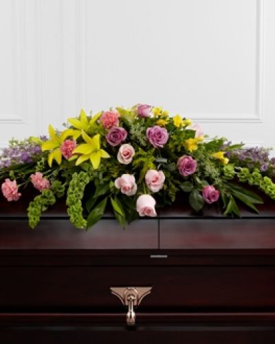 <p>This casket spray presents an elegant expression of enduring love, designed to bring light and peace to a memorial service. Lavender roses, delicate pink roses, and lavender larkspur evoke affection and serenity, while cheerful yellow Asiatic lilies and golden freesia add a hopeful sense of renewal.</p>