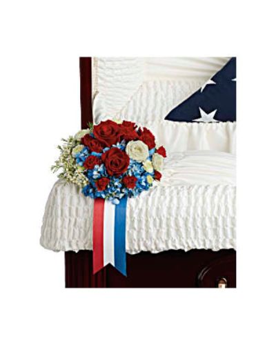 <p>Designed to adorn the casket, this striking blend of red, white, and blue blooms serves as a proud display of patriotism and a touching tribute to a legacy built on honor.</p>
