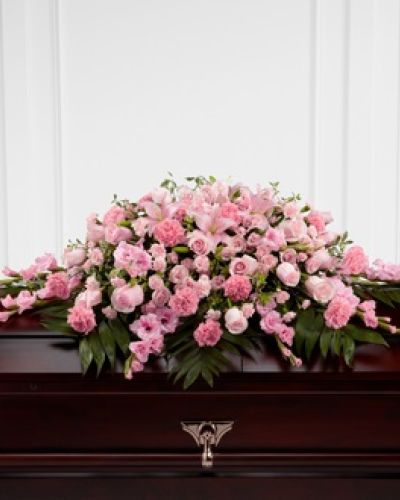 <p>Celebrate the life of someone who brought sweetness and compassion into the world with this elegant casket spray. Thoughtfully designed to rest atop the casket, it honors the memory of a loved one with soft pink blooms and lush greenery that reflect tenderness, grace, and heartfelt love.</p>