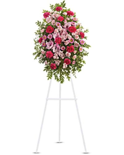 <p>Celebrate a life filled with warmth and grace with a soft and feminine standing arrangement that offers comfort, beauty, and heartfelt remembrance. Designed to convey love and sympathy, this delicate spray is a meaningful way to honor someone cherished and deeply missed.</p>