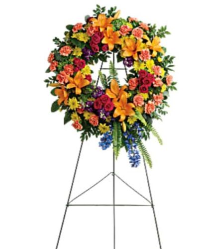 <p>Celebrate the vibrant spirit of a loved one with a radiant floral wreath that reflects the beauty, joy, and warmth they brought to the world. Designed in a full circle to symbolize eternal love and remembrance, this striking sympathy wreath brings comfort to grieving hearts while honoring a life filled with colorful memories.</p>