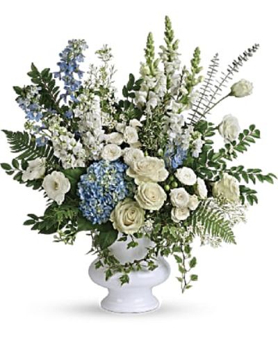 <p>Honor the memory of a cherished loved one with a serene and elegant bouquet that blends soft blue and pure white blooms. The bouquet features a delicate mix of light blue hydrangea, white roses, white spray roses, white lisianthus, light blue delphinium, white snapdragons, white stock, and white waxflower.</p>