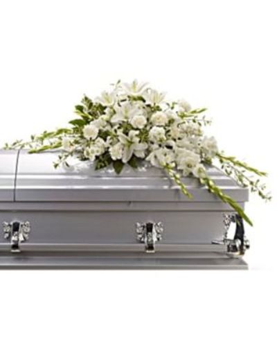 <p>Offer comfort and reverence with an elegantly composed casket spray of all-white blooms and fresh greenery. Designed to convey peace, purity, and timeless love, this crescent-shaped half-casket spray brings a calming presence to the service, honoring the departed with affection and quiet dignity.</p>