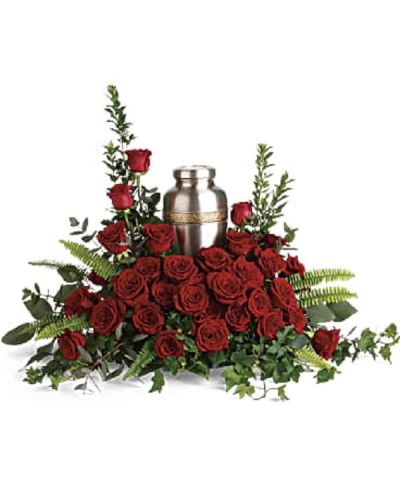 <p>This elegant arrangement is designed to beautifully complement a cremation urn and offer comfort to grieving hearts. The design features rich red roses paired with delicate greenery including myrtle, green ivy, sword fern, silver dollar eucalyptus, and lemon leaf.</p>
