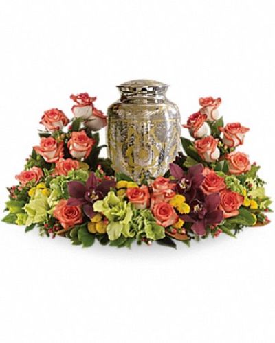 <p>Offer a heartfelt tribute that gently embraces cherished memories with grace and warmth. The oval-shaped garden features a harmonious blend of orange roses combined with cymbidium orchids, gladioli, chrysanthemums, hypericum, and delicate greenery.</p>