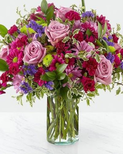 <p>Dazzle your loved ones with stunning violet and green hues set within a glass cylinder vase. A collection of roses, daisies and statice, our Sweet Nothings Bouquet sends sweet sentiment deep within each bloom.</p>