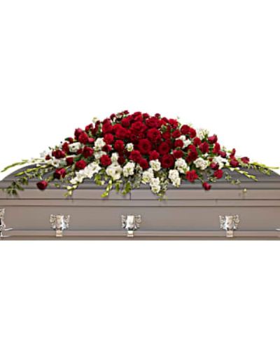 <p>Pay tribute to a life of deep love and enduring devotion with a traditional and dramatic casket spray. This striking arrangement combines red and white blooms, symbolizing both passionate remembrance and peaceful farewell.</p>