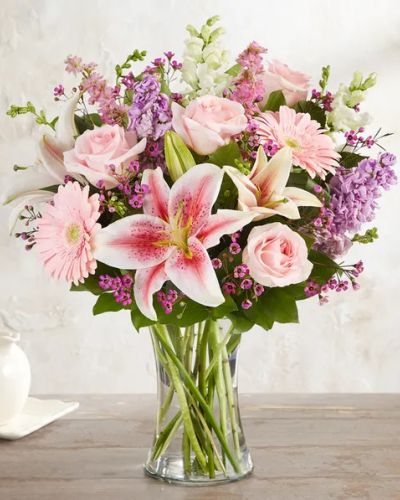 <p>Let her know she’s always in your thoughts with a bouquet that speaks the language of love through soft pinks and gentle lavenders. This elegant design features a lush mix of pink and purple blooms, carefully selected to convey warmth, affection, and grace.</p>