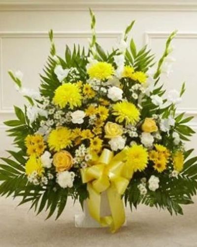 <p>This Touching Tribute Floor Basket in yellow offers a warm, uplifting expression of sympathy that shines with hope, remembrance, and heartfelt support. The thoughtful floor basket features a sunny selection of fresh yellow roses, bright yellow cremones, crisp white gladiolas, soft carnations, monte casino, and seasonal greenery.</p>