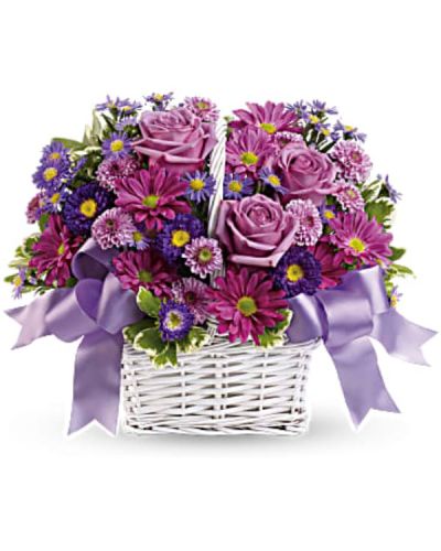 <p>The bouquet features a charming mix of lavender daisy spray chrysanthemums, dark purple asters, lavender cushion spray chrysanthemums, and purple asters. Accented with fresh greenery, the flowers are artfully arranged to create a vibrant and harmonious display.</p>