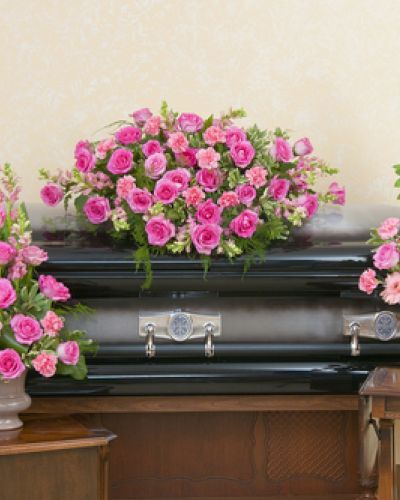 <p>Offer a gentle farewell filled with grace, love, and quiet beauty. This coordinated set includes a delicate casket spray, a standing spray, and an urn arrangement, all designed in soft shades of pink.</p>