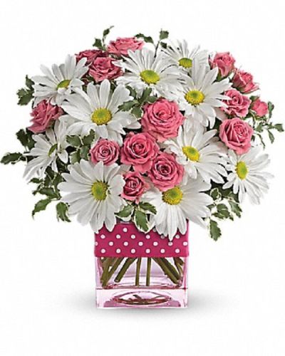 <p>This bouquet features soft pink spray roses paired with crisp white daisy spray chrysanthemums. These classic blooms are arranged in a stylish pink vase and finished with a polka-dot satin ribbon, creating a cheerful and modern presentation that adds a fun and vibrant flair.</p>
